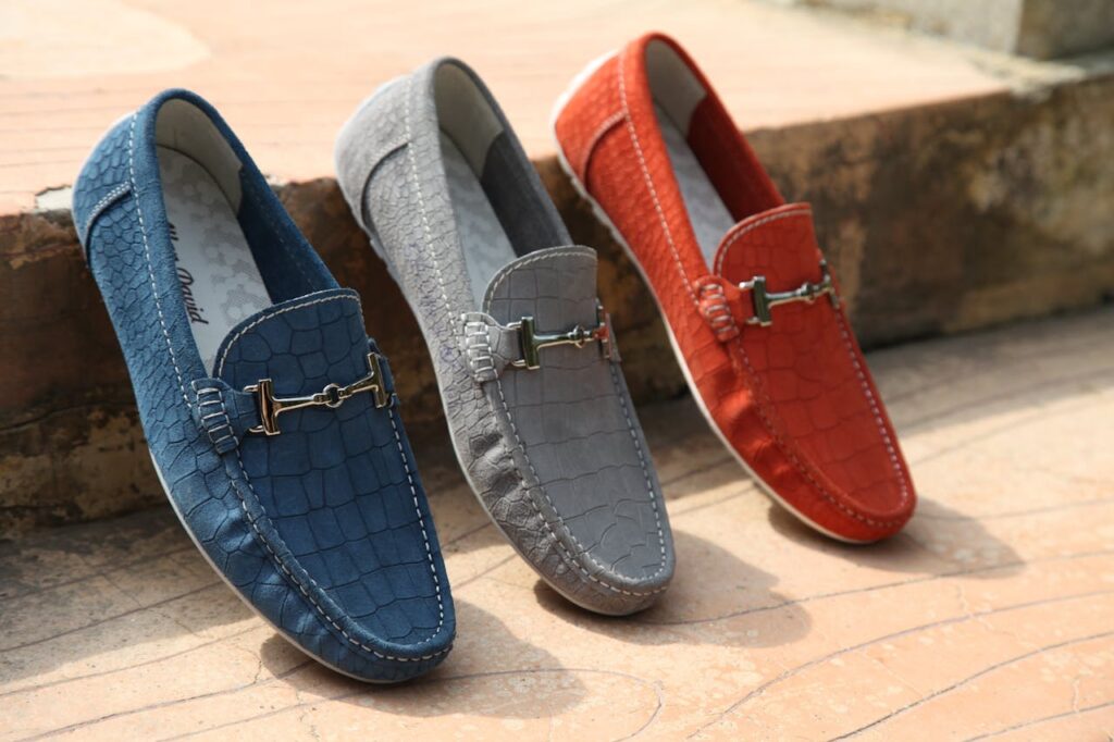 The Art of Drawing Readers In: Your attractive post title goes here Three colorful leather loafers displayed outdoors showcasing style and elegance.