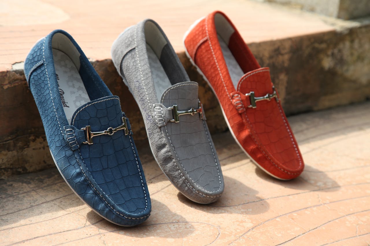 The Art of Drawing Readers In: Your attractive post title goes here Three colorful leather loafers displayed outdoors showcasing style and elegance.